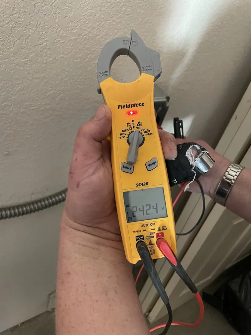 Voltage testing with clamp meter during Circuit Breaker Repair in Buckeye